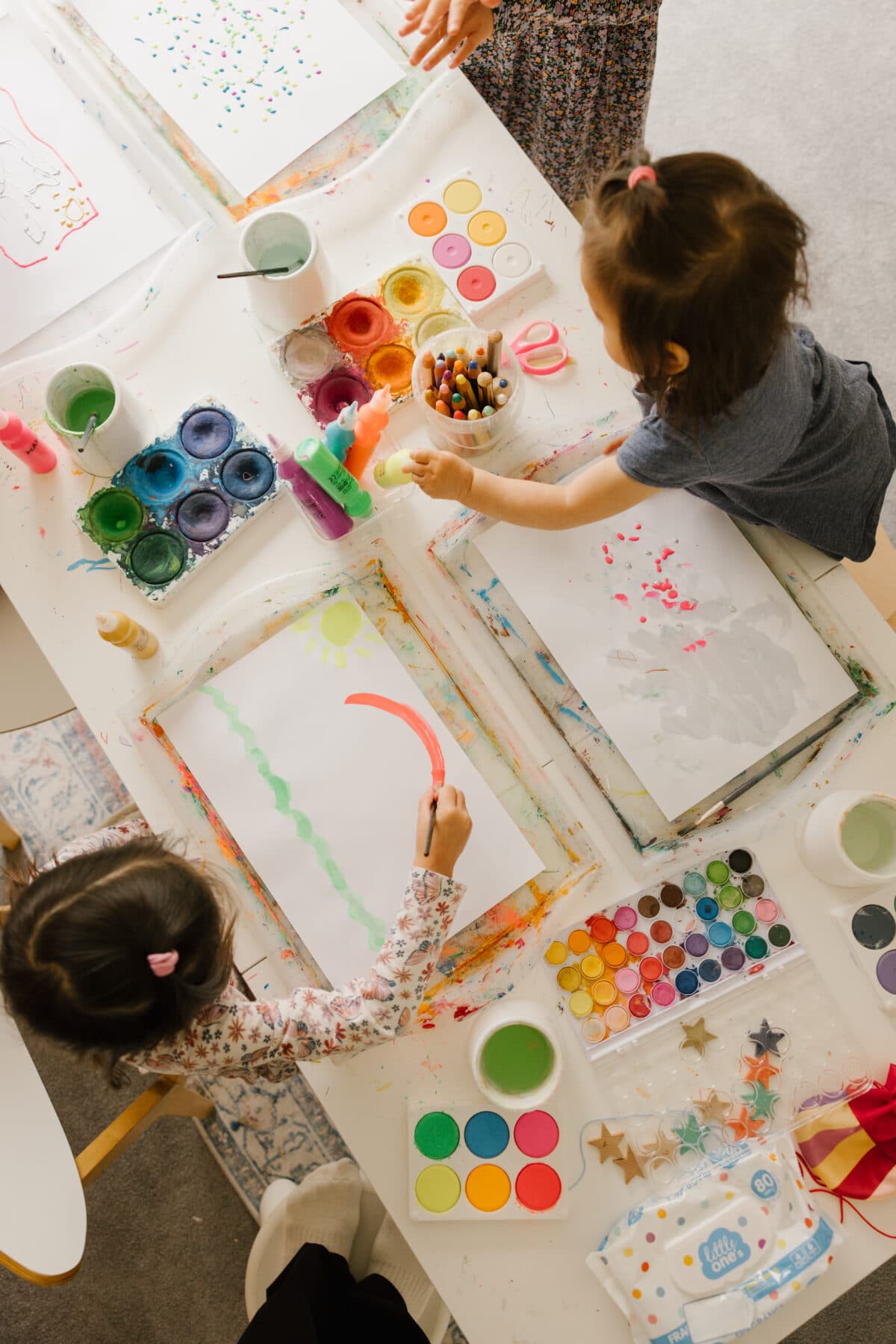 Children working with watercolors at an art table